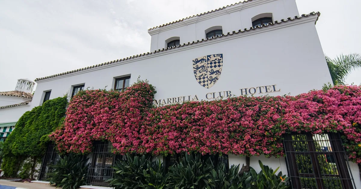White entrance building of the Marbella Club Hotel covered in bougainvillea on the Golden Mile