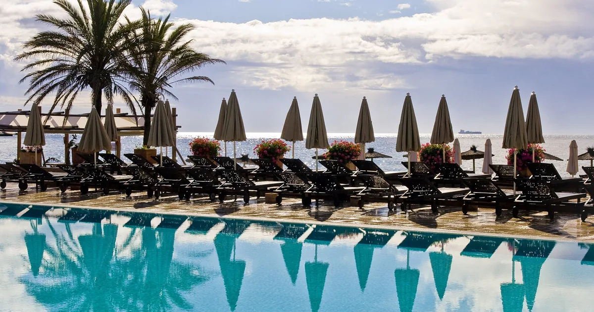 Poolside sunbeds and parasols facing the Mediterranean in Marbella — Nobu Hotel Marbella guide