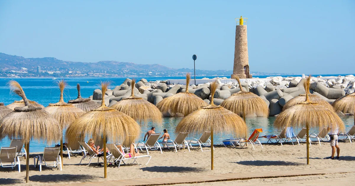 Playa Puerto Banús Beach with tranquil water & a cafe — Pangea Marbella, 2026 guide