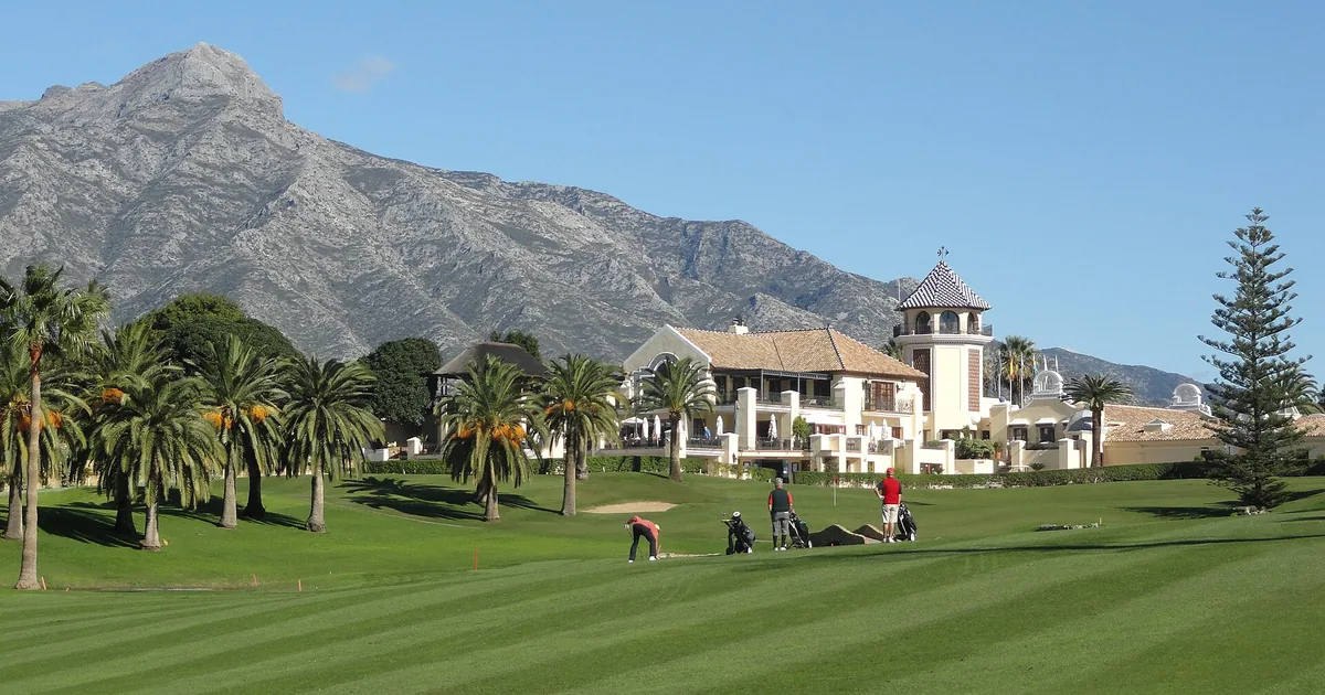 Golf Valley in Nueva Andalucía, Marbella, with La Concha mountain behind a clubhouse and fairway next to Las Brisas